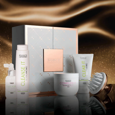 Voduz Christmas Hair Bundle product set with a decorative box on a reflective surface.