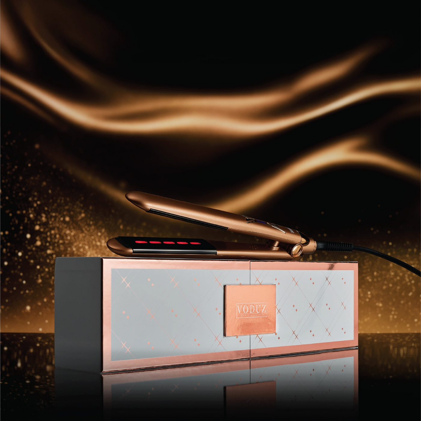 Voduz Bronze Infrared Straightener - hair straightener with packaging on a dark background