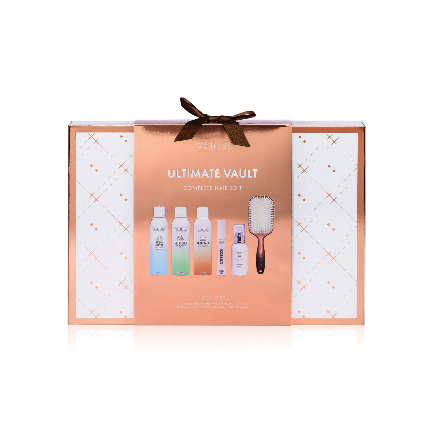 hair care set in a 'Ultimate Vault' box with bottles and a brush on a white background