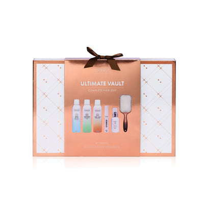 hair care set in a 'Ultimate Vault' box with bottles and a brush on a white background