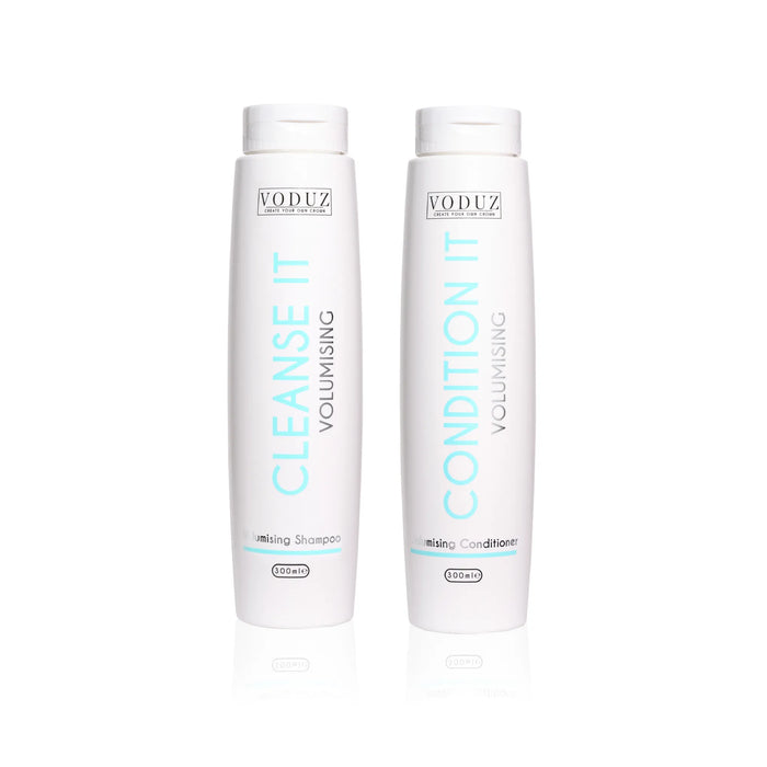 Two VODUZ shampoo and conditioner bottles on a white background