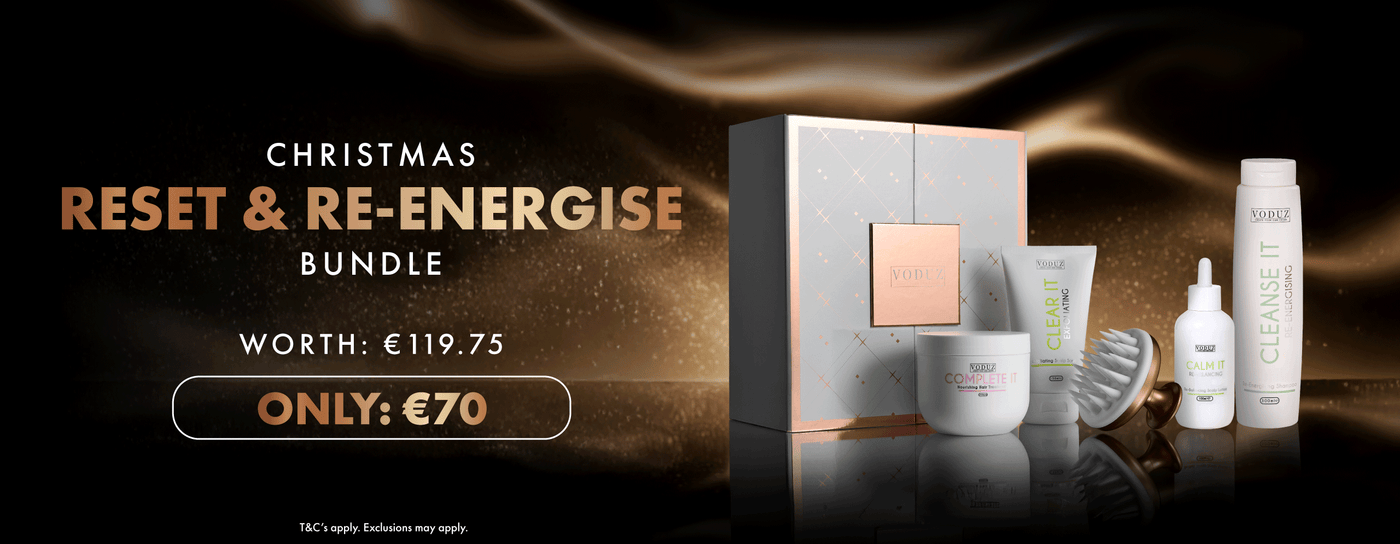 Voduz hair care bundle with packaging and bottles on a dark background, featuring text for a Christmas offer.